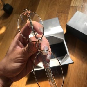 Percy lau gold frame glasses.